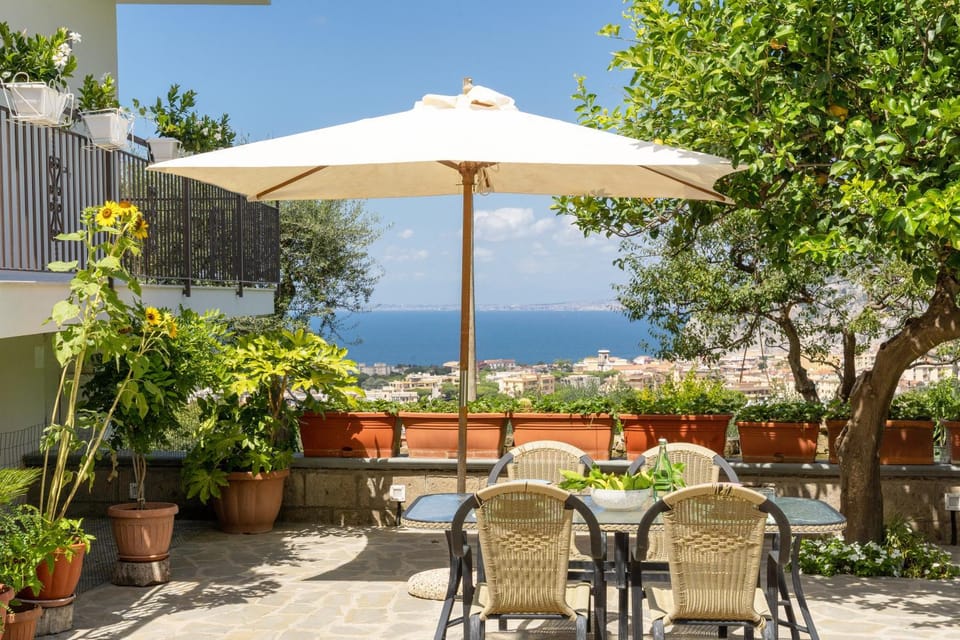 Property building, Patio, Spring, Day, Natural landscape, Garden, View (from property/room), Dining area, Garden view, Sea view