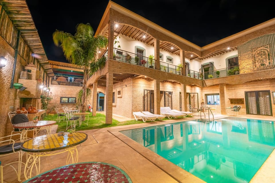 Property building, Patio, Night, Pool view, Swimming pool