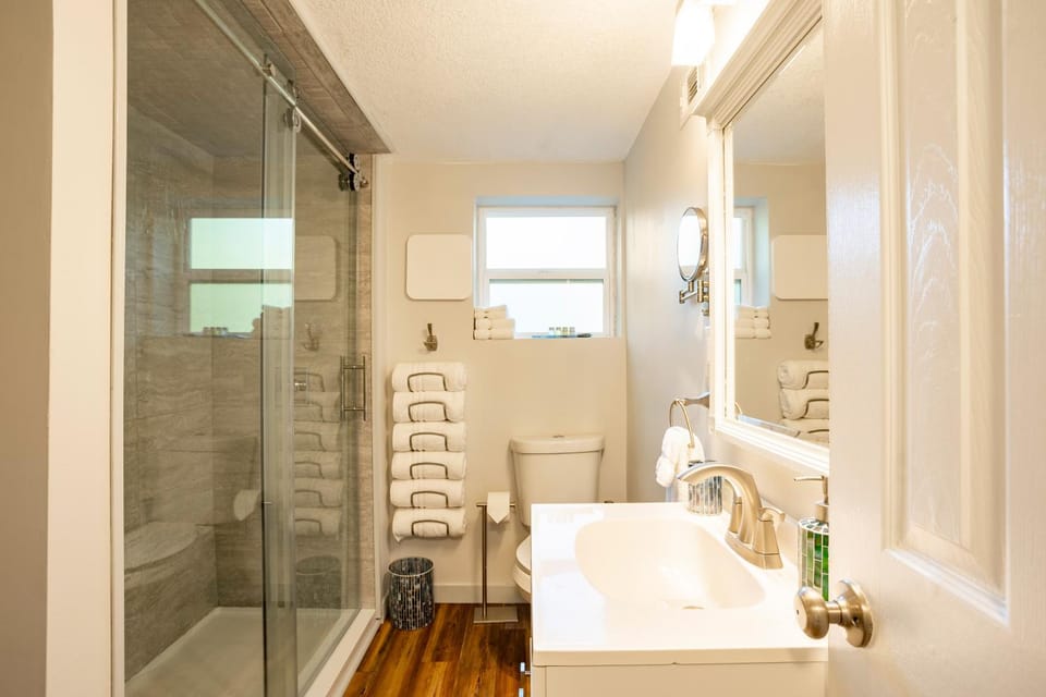Shower, Toilet, Bathroom, hair dryier, towels, washing machine, dryer