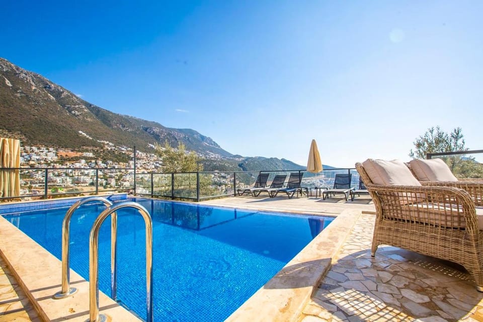 View (from property/room), Mountain view, Pool view, Sea view, Swimming pool