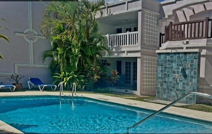 Property building, Pool view, Swimming pool, sunbed
