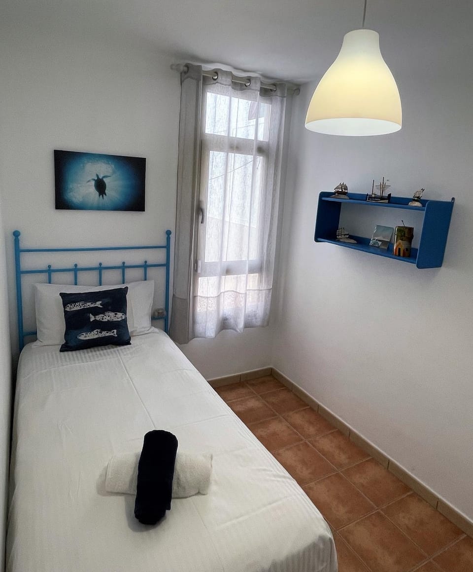 Bed, Night, Inner courtyard view, locker, towels, wardrobe
