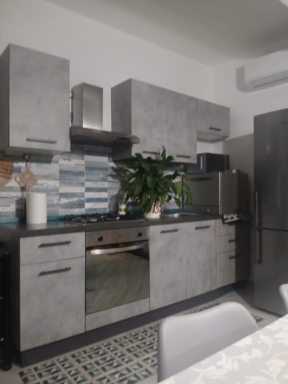 Kitchen or kitchenette, dishwasher, oven, stove
