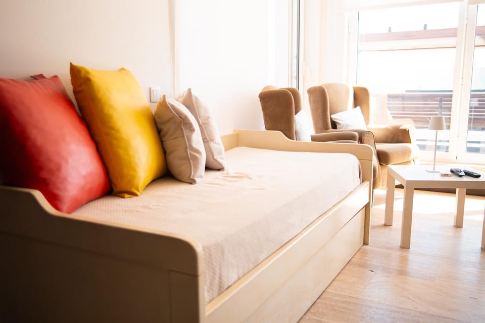 Bed, Living room, Seating area, Bedroom
