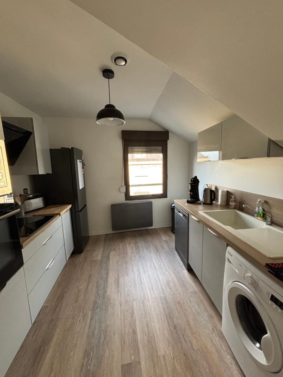 Kitchen or kitchenette, dishwasher, stove, toaster