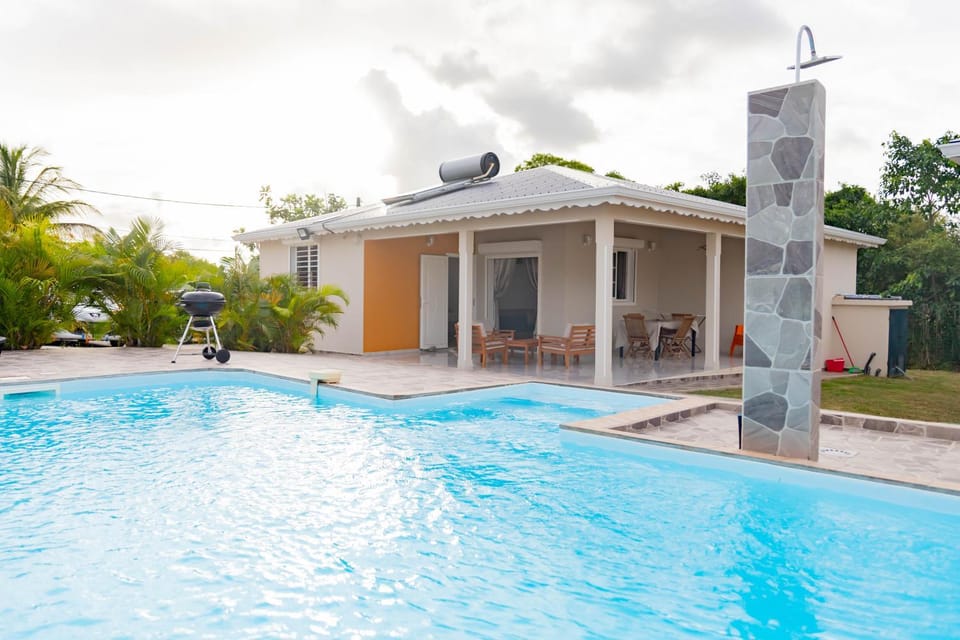 Property building, Patio, Day, BBQ facilities, View (from property/room), Pool view, Swimming pool, sunbed