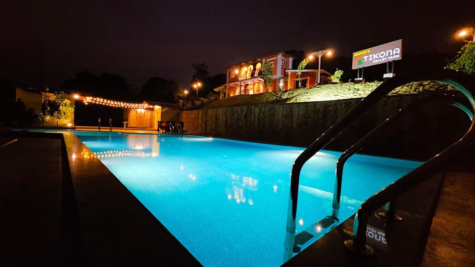 Property building, Night, Property logo or sign, Pool view, Swimming pool