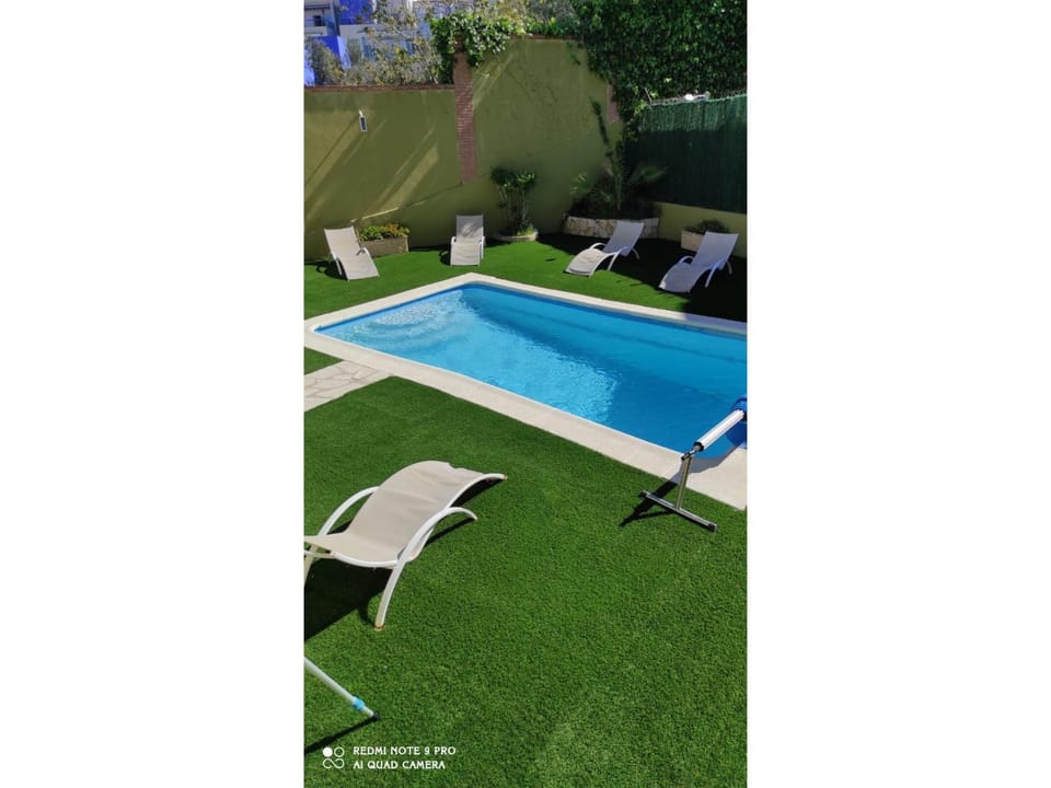 Property building, Living room, Swimming pool