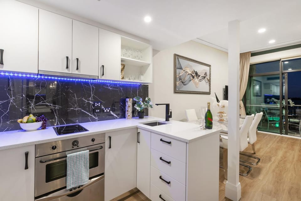 Kitchen or kitchenette, dishwasher, oven, stove