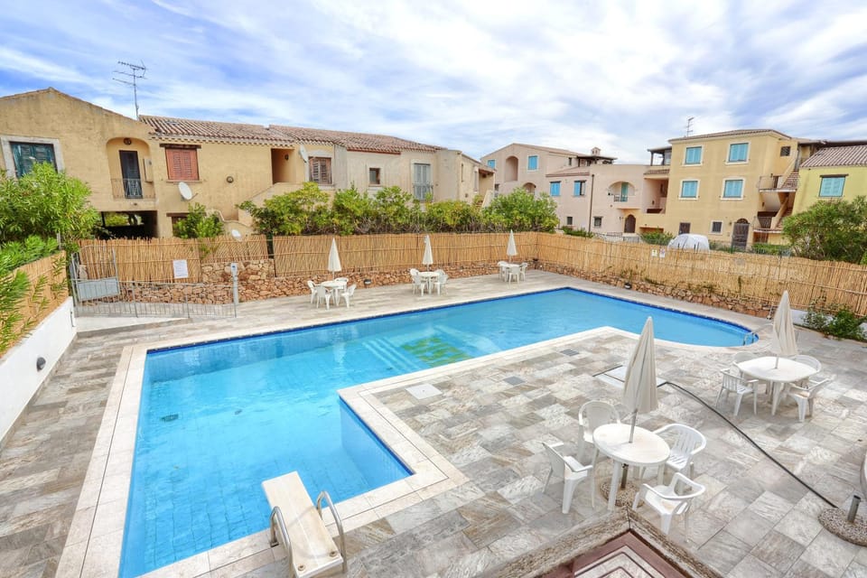 Property building, Patio, Pool view, Swimming pool, sunbed