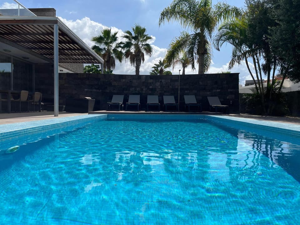 Property building, Living room, Swimming pool
