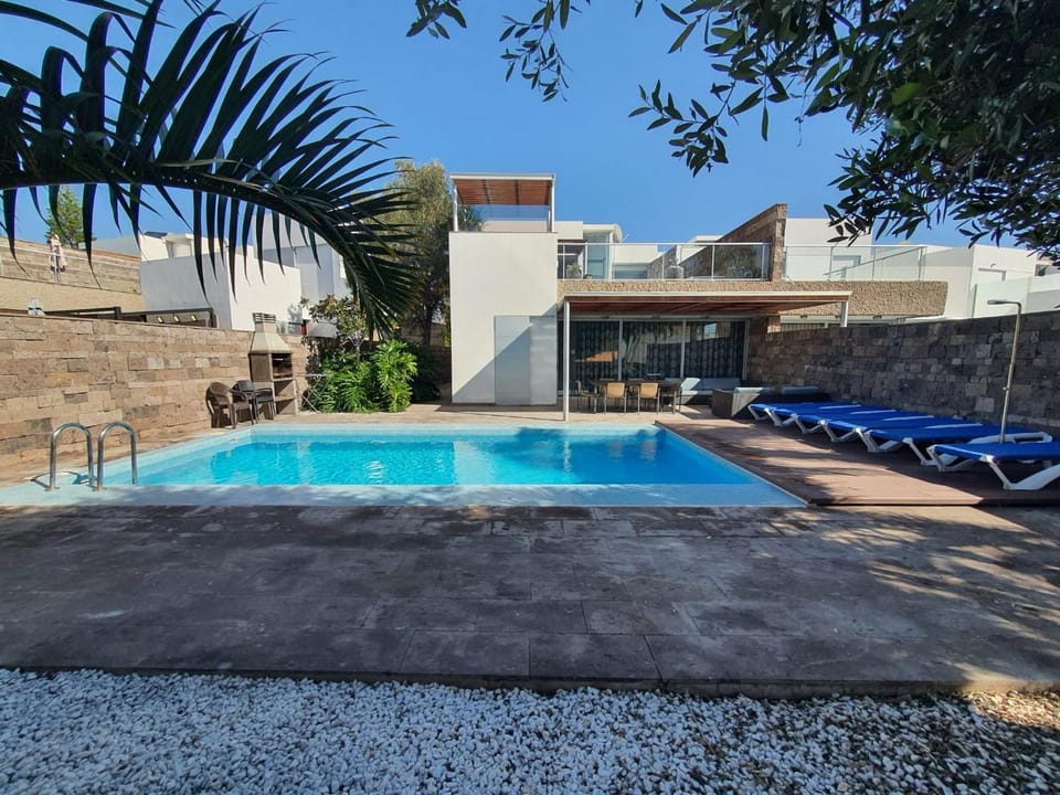 Property building, Living room, Swimming pool