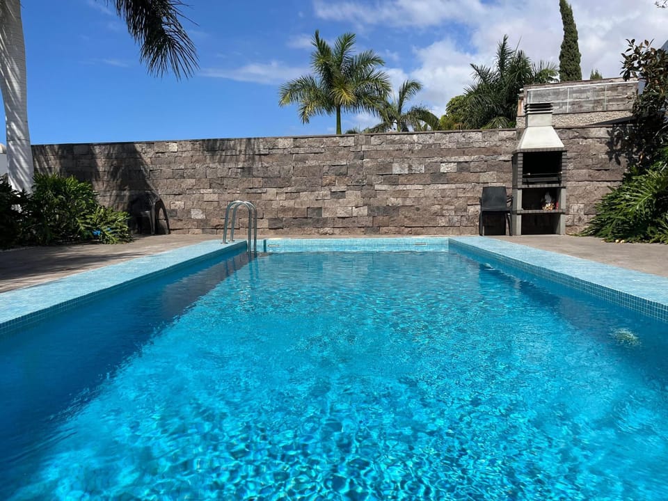 Property building, Living room, Swimming pool