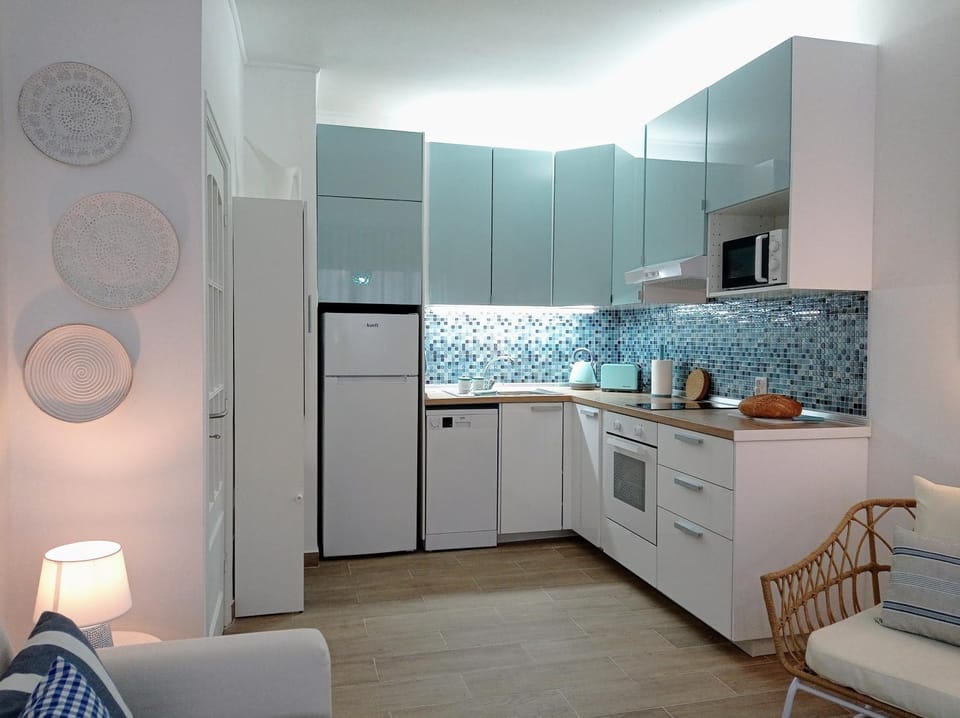 Kitchen or kitchenette, dishwasher, oven, stove, toaster