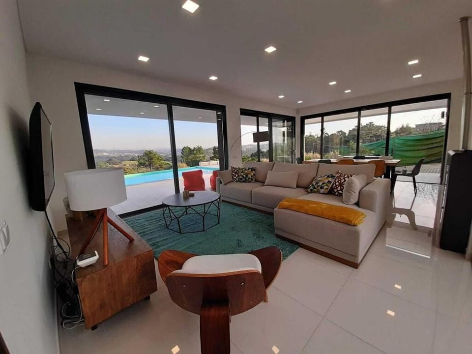 TV and multimedia, Living room, Seating area, Evening entertainment, Pool view, Swimming pool