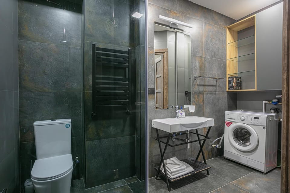 Shower, Toilet, Bathroom, towels, washing machine, dryer