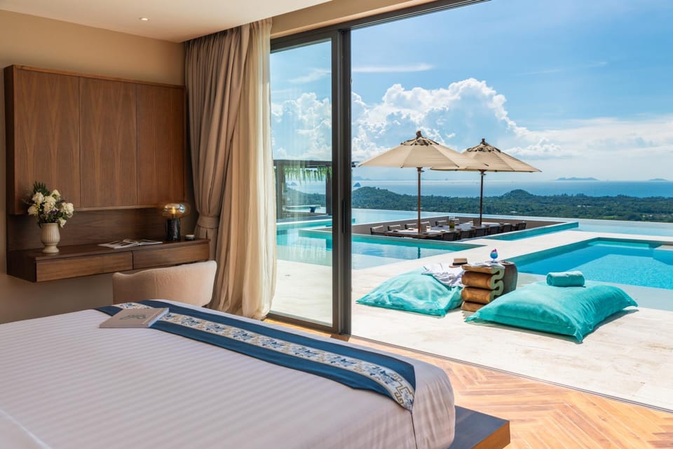Bed, View (from property/room), Seating area, Pool view, Sea view, Swimming pool
