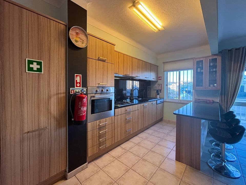 Kitchen or kitchenette, dishwasher, microwave, oven, stove