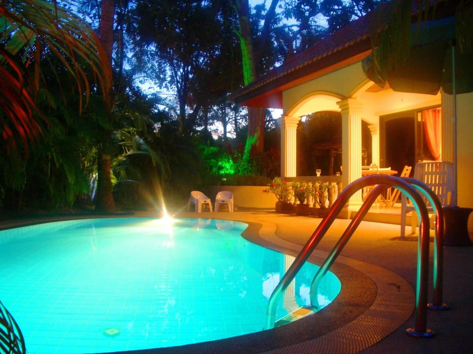 Property building, Patio, Dining area, Swimming pool