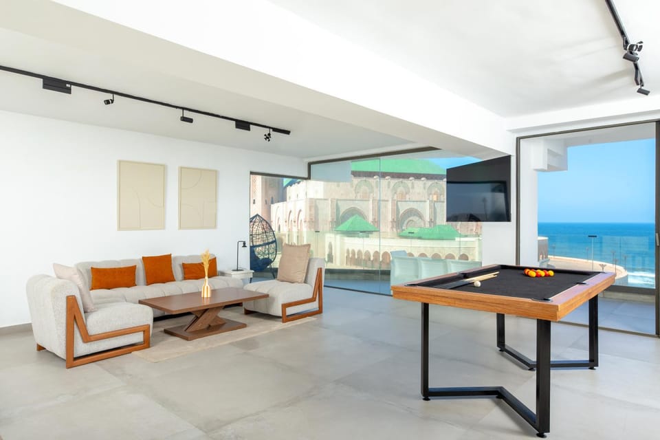 Natural landscape, Billiard, Living room, Seating area, Sea view