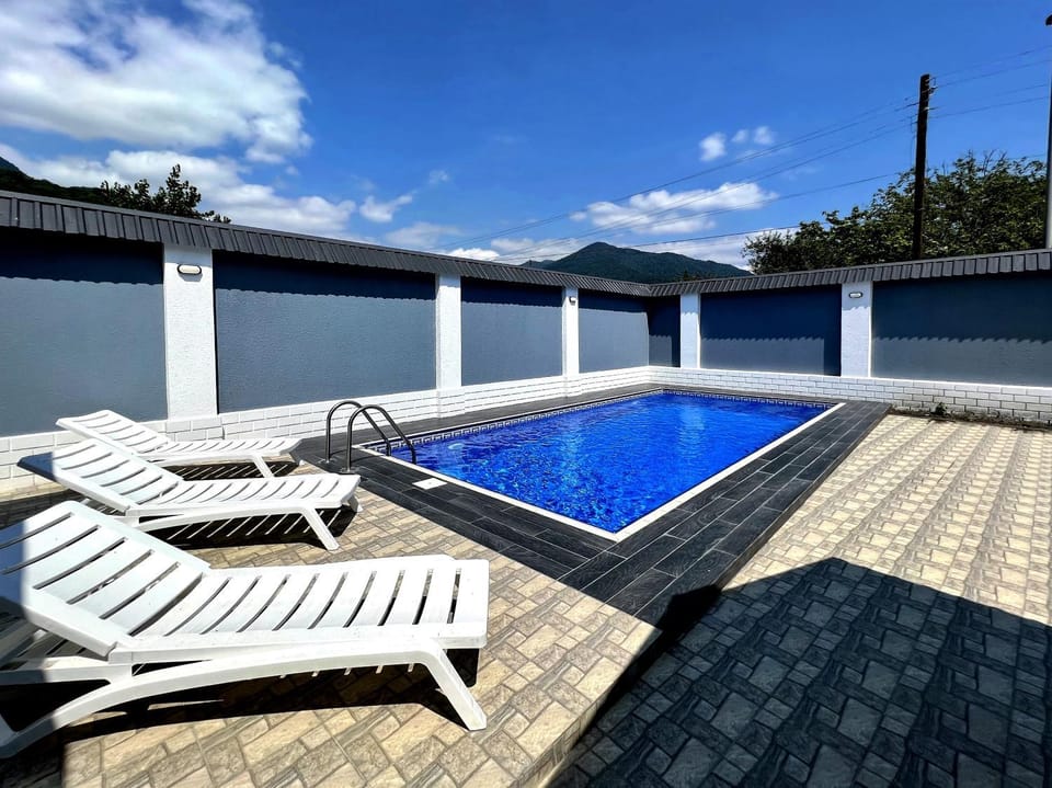 Patio, Day, Natural landscape, Pool view, Swimming pool, sunbed