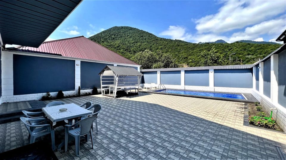 Property building, Patio, Day, Natural landscape, View (from property/room), Balcony/Terrace, Mountain view, Pool view, Swimming pool, sunbed