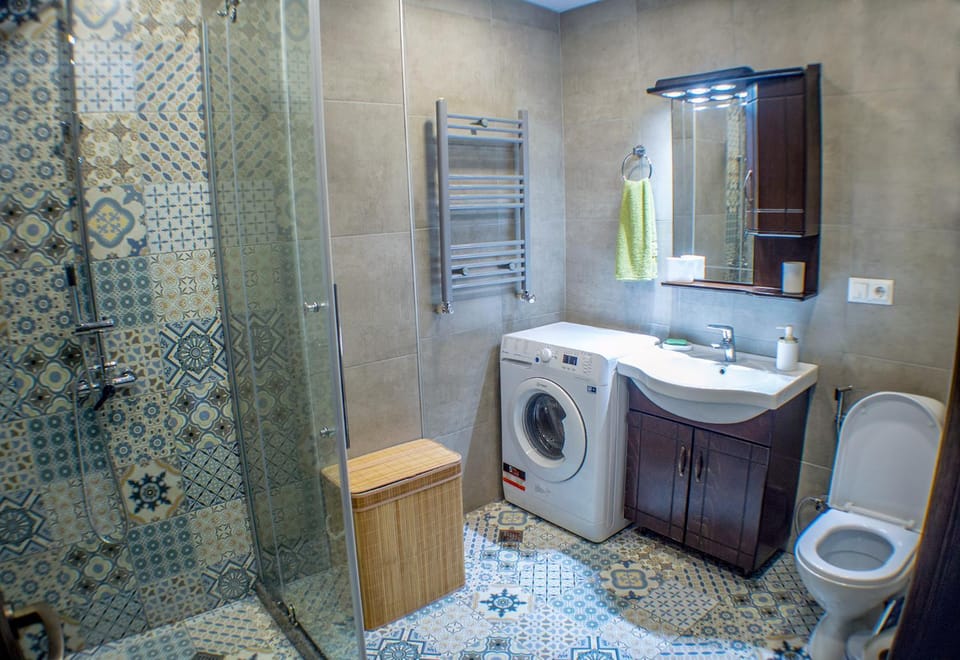 Shower, Toilet, Bathroom, towels, washing machine, dryer