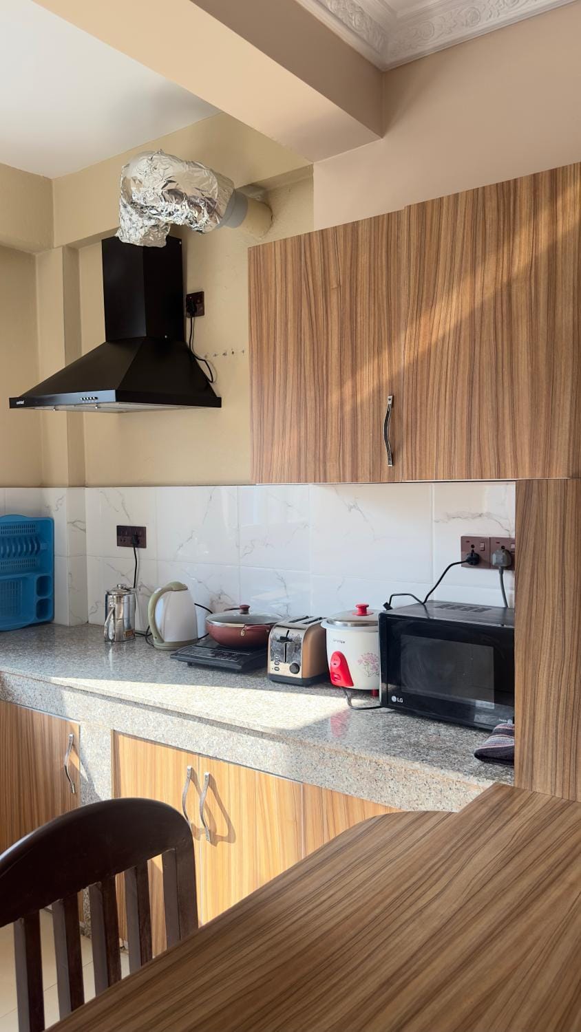 Kitchen or kitchenette, microwave, stove, toaster, kitchen