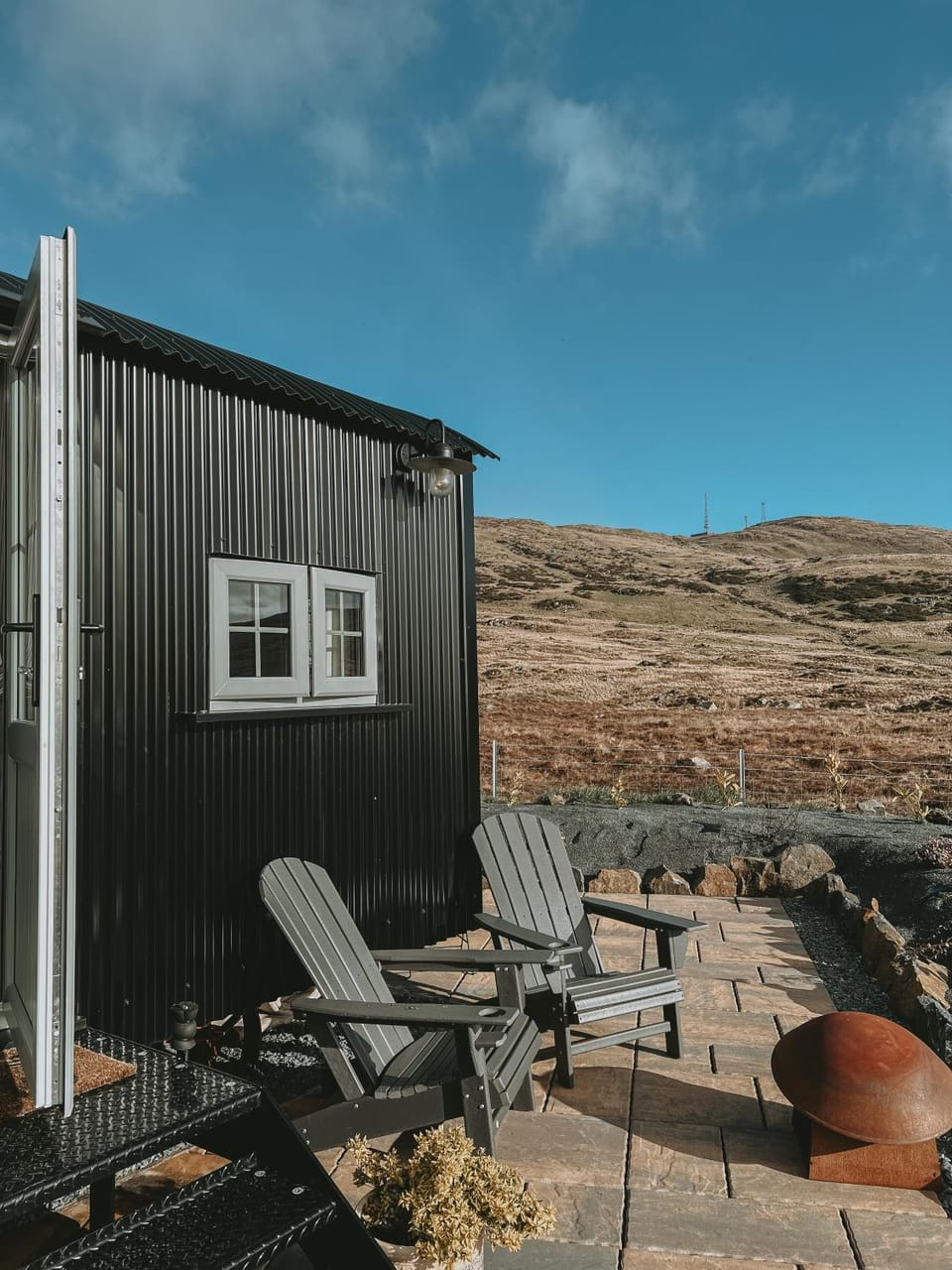 Black hut at Slieve Croob Glamping Chalet in Northern Ireland