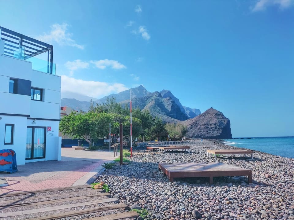 Property building, Facade/entrance, Natural landscape, Beach, Sea view
