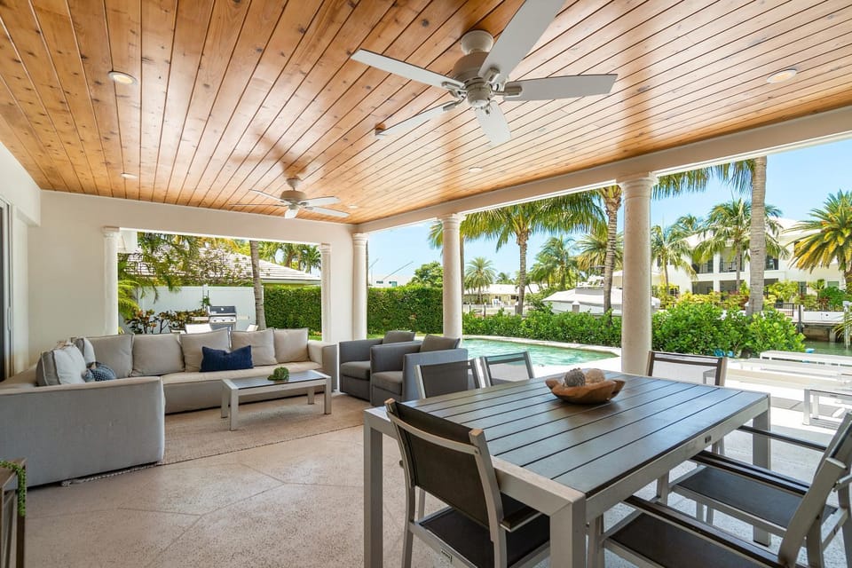 Seven Palms Waterfront- Private Dock, Heated Pool & Lanai -Walk to beach! by Maven Vacation Rentals Villa in Riviera Beach