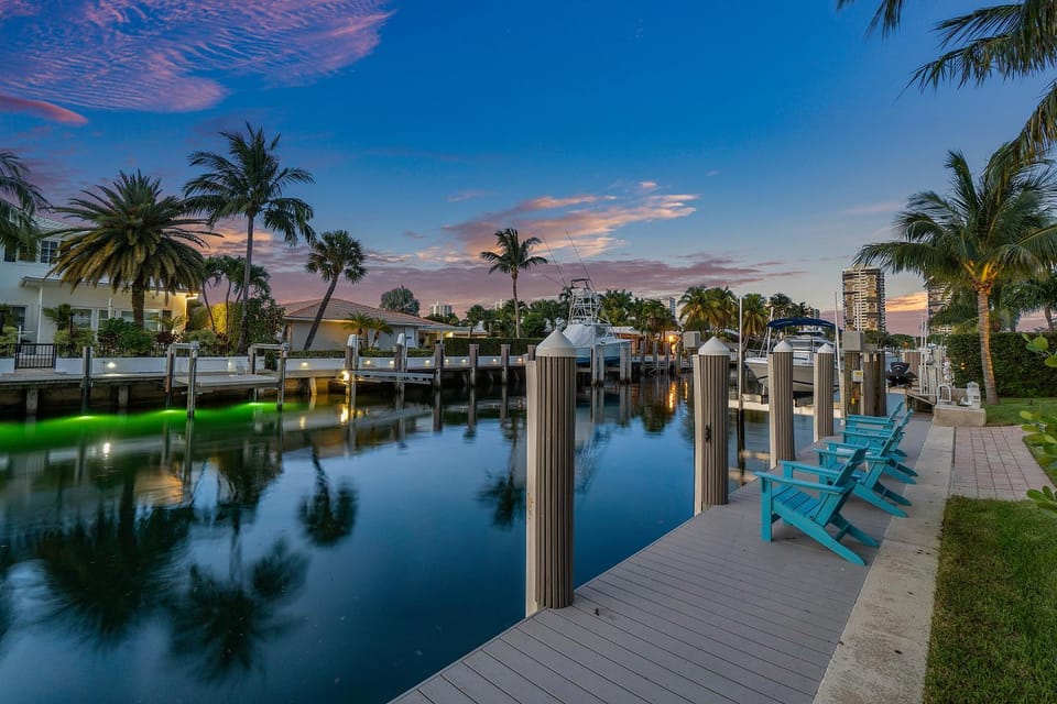Seven Palms Waterfront- Private Dock, Heated Pool & Lanai -Walk to beach! by Maven Vacation Rentals Villa in Riviera Beach