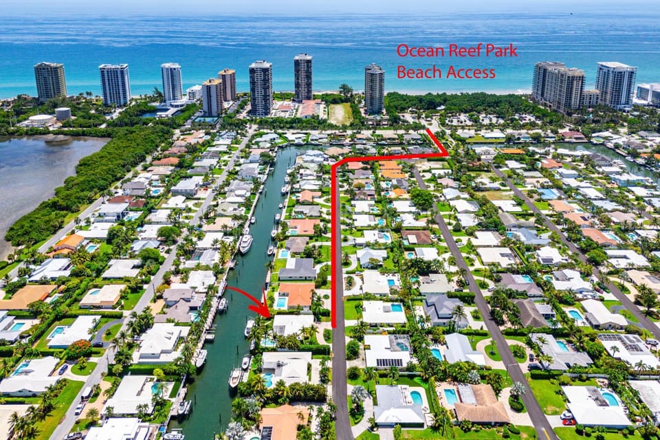 Seven Palms Waterfront- Private Dock, Heated Pool & Lanai -Walk to beach! by Maven Vacation Rentals Villa in Riviera Beach