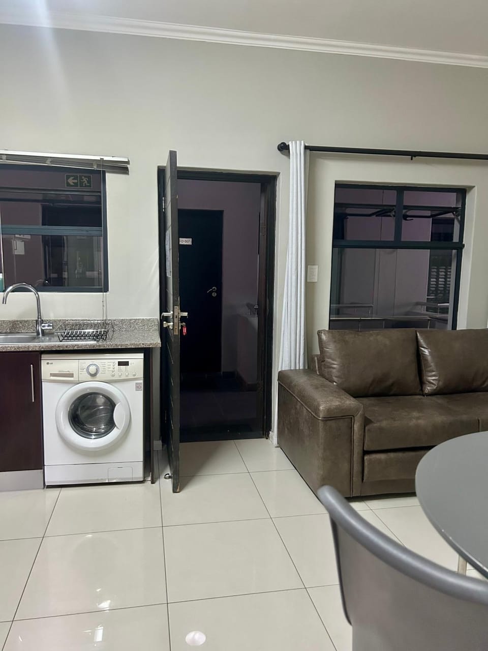 Kitchen or kitchenette, Living room, Seating area, washing machine