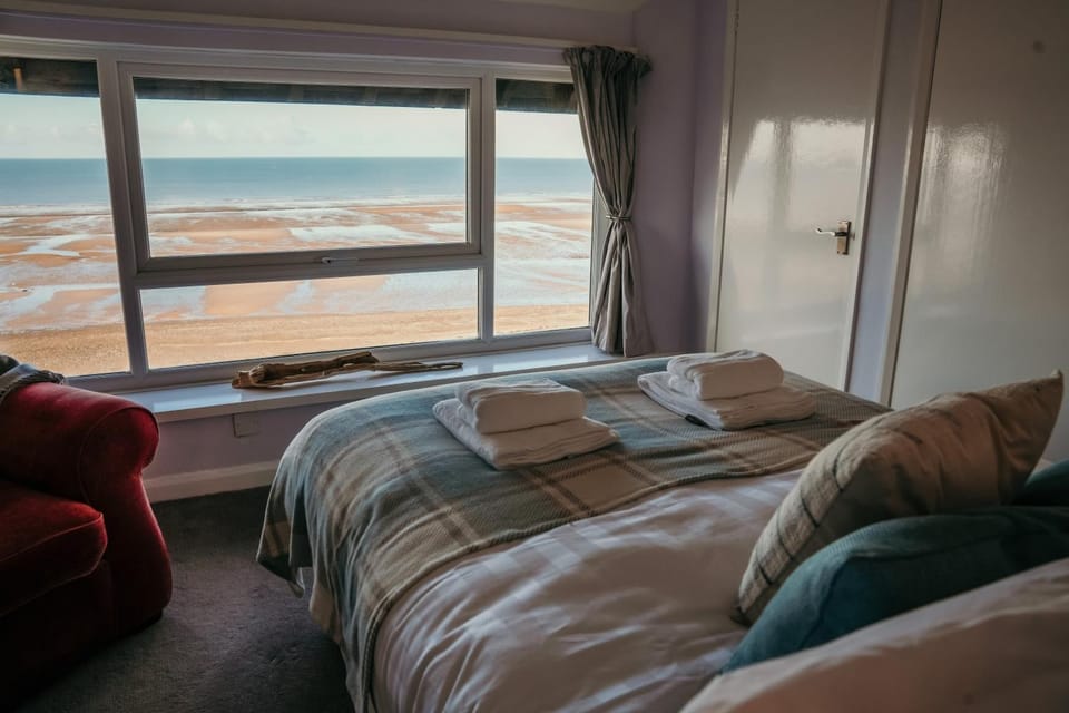 Bed, Living room, Seating area, Sea view