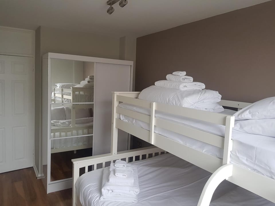 bunk bed, towels, wardrobe