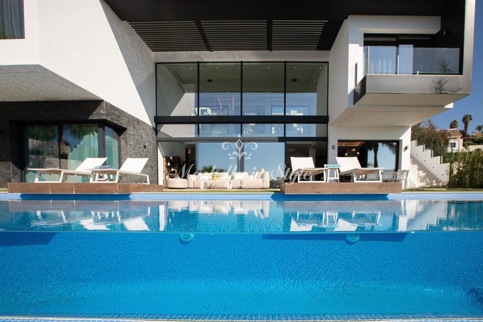 Property building, Patio, Pool view, Swimming pool, sunbed