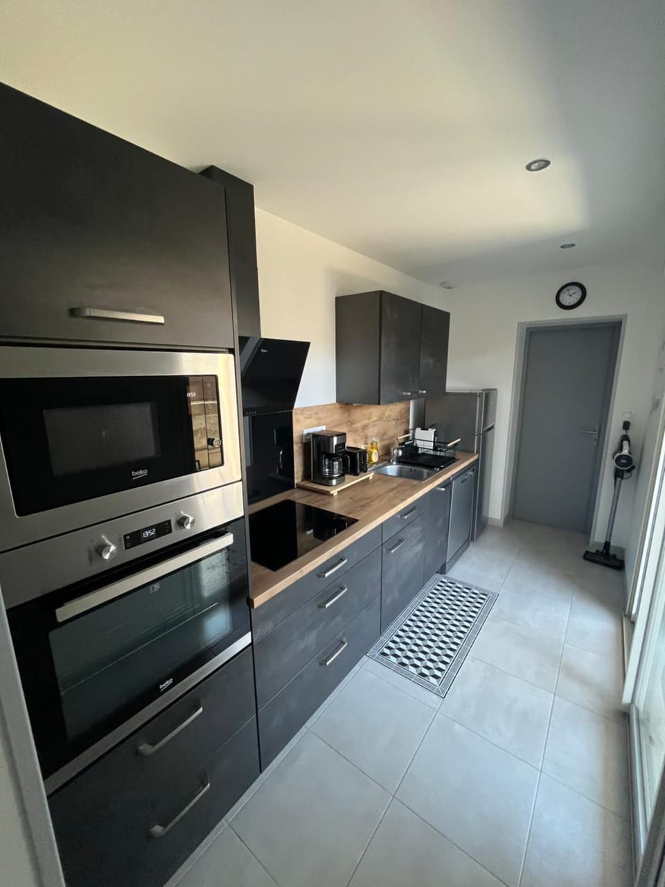 Kitchen or kitchenette, dishwasher, oven, stove