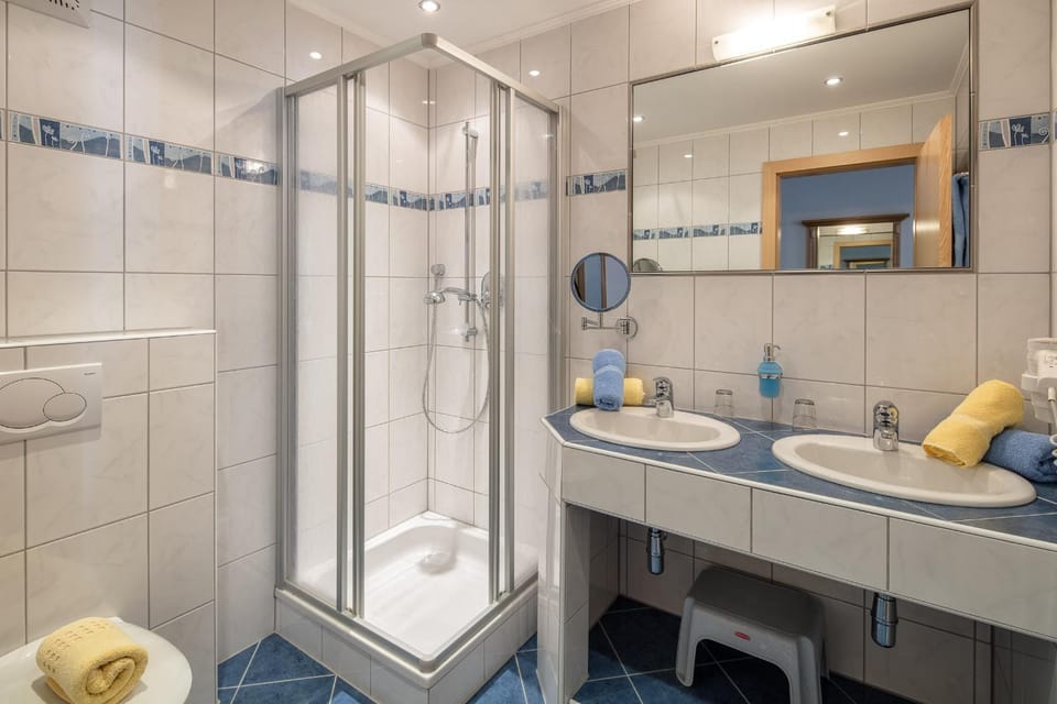 Shower, Toilet, Bathroom, hair dryier, towels