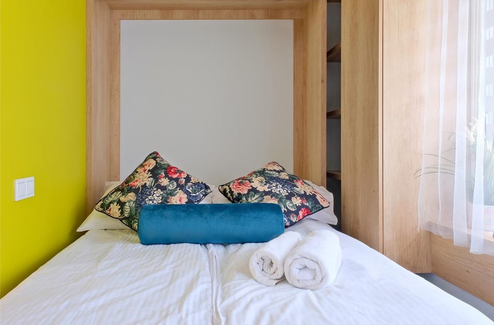 Bed, towels, wardrobe