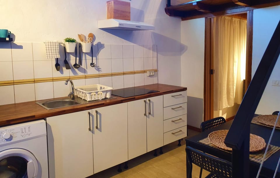 Kitchen or kitchenette, stove, washing machine