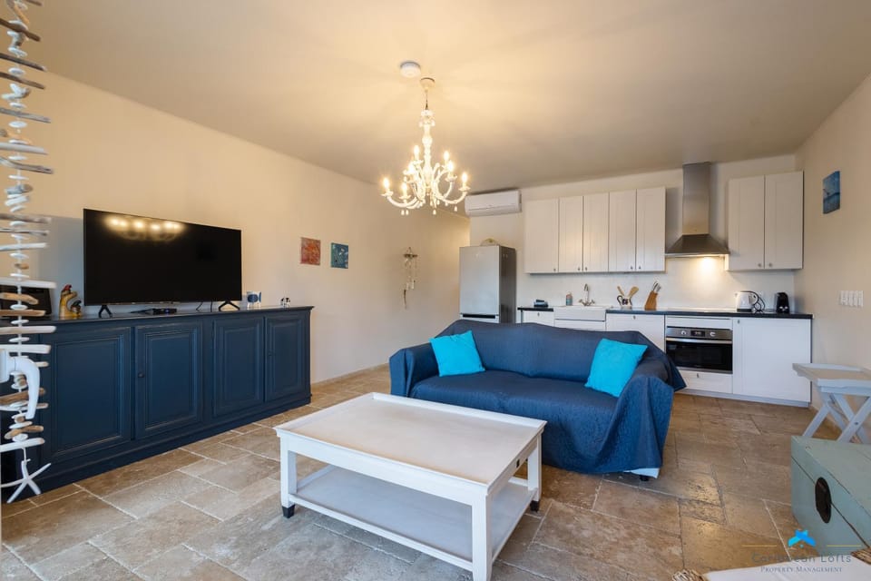 TV and multimedia, Kitchen or kitchenette, Living room, Seating area, dishwasher, stove, air conditioner
