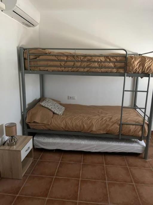 Photo of the whole room, bunk bed, air conditioner