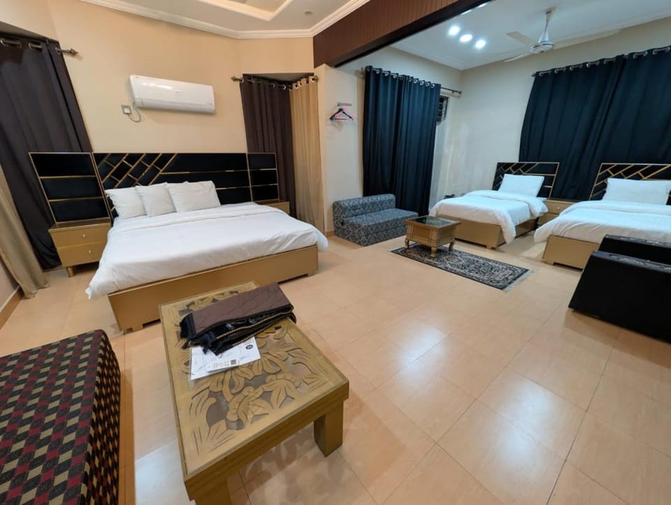 Bed, TV and multimedia, Living room, Seating area, Bedroom, towels, air conditioner