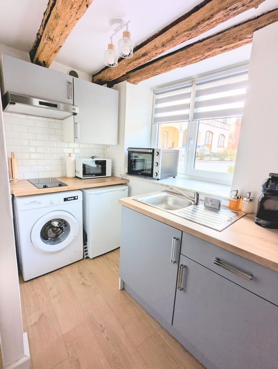 Kitchen or kitchenette, microwave, oven, stove, washing machine