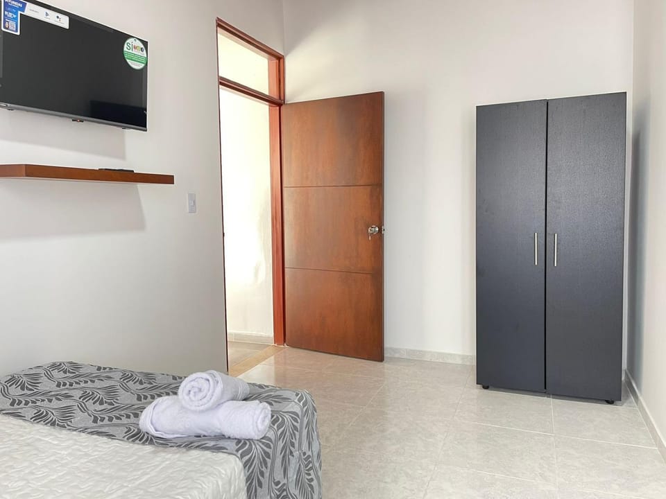 Bed, TV and multimedia, Bedroom, towels, wardrobe