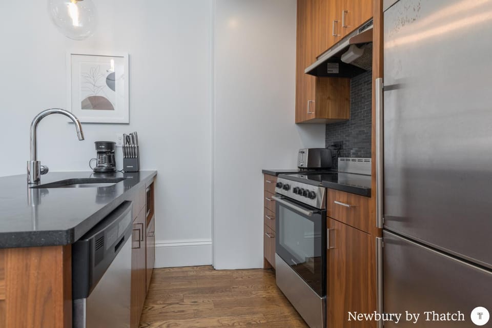 Kitchen or kitchenette, dishwasher, oven, stove, toaster