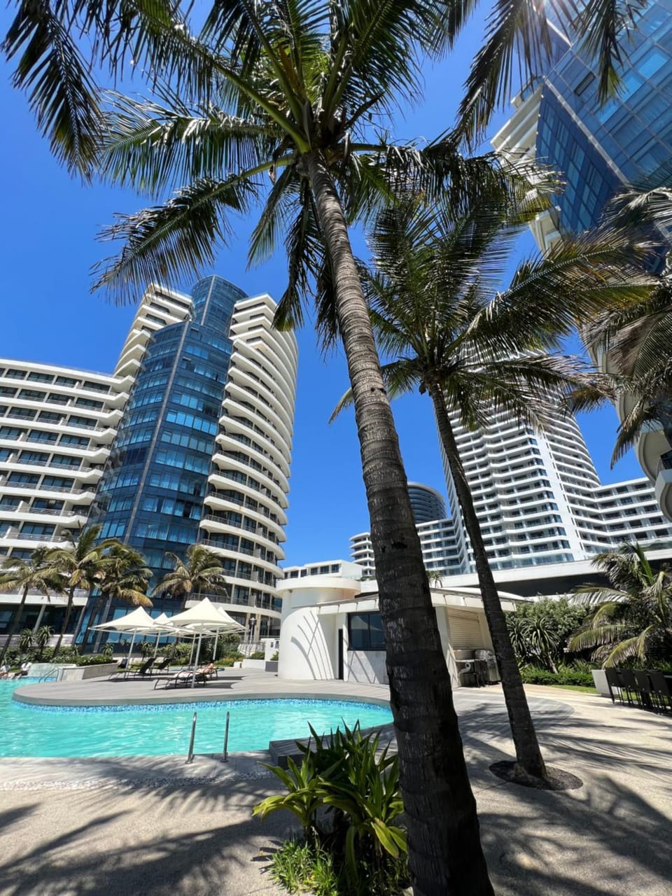 Property building, Day, Pool view, Swimming pool, sunbed