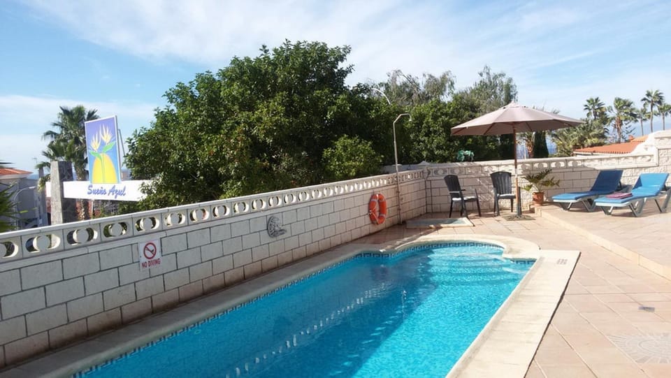 Property building, Living room, Swimming pool