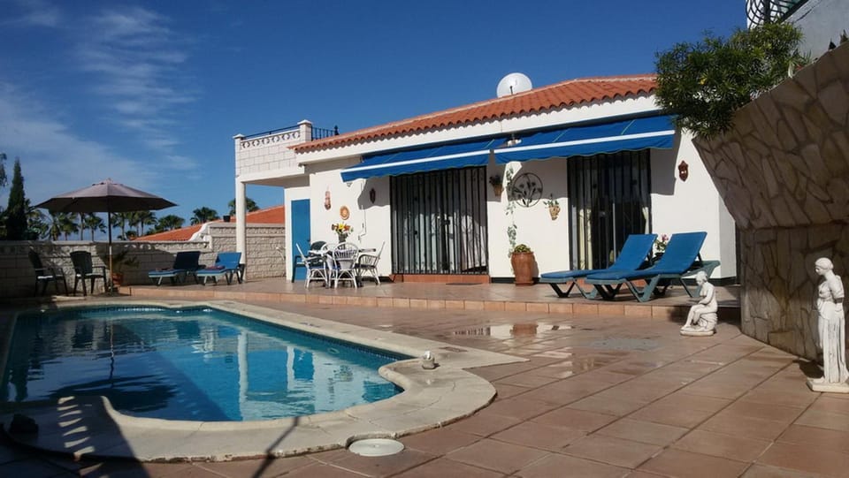 Property building, Living room, Swimming pool